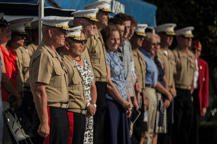 U.S. Marines and their guests attend a change of command ceremony at Marine Corps Base Camp Pendleton, Calif., July 30, 2015. The ceremony signifies the transfer of responsibility and authority of 1st Marine Division between Commanding Generals. (U.S. Marine Corps photo by Lance Cpl. Ryan Kierkegaard/Released)