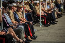 U.S. Marines and their guests sit during a change of command ceremony at Marine Corps Base Camp Pendleton, Calif., July 30, 2015. The ceremony signifies the transfer of responsibility and authority of 1st Marine Division between Commanding Generals. (U.S. Marine Corps photo by Lance Cpl. Ryan Kierkegaard/Released)