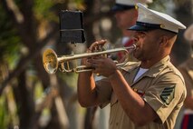 U.S. Marines Corps Staff Sgt. Steven Santiago-Ramos, a trumpet player with the 1st Marine Division Band, performs during a change of command ceremony at Marine Corps Base Camp Pendleton, Calif., July 30, 2015. The ceremony signifies the transfer of responsibility and authority of 1st Marine Division between Commanding Generals. (U.S. Marine Corps photo by Lance Cpl. Ryan Kierkegaard/Released)