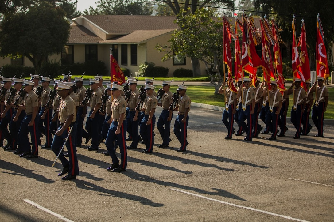 U.S. Marines with 1st Marine Division march in formation during the 1st Marine Division change of command ceremony at Marine Corps Base Camp Pendleton, Calif., July 30, 2015. The ceremony signifies the transfer of responsibility and authority of 1st Marine Division between Commanding Generals. (U.S. Marine Corps photo by Lance Cpl. Ryan Kierkegaard/Released)