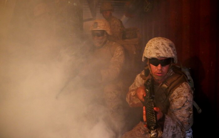 U.S. Navy corpsmen and Marines, assigned to various units in the 1st Marine Division, conduct tactical combat casualty care training during the Combat Trauma Management Course, taught by instructors with the 1st Mar. Div. Navy Education and Training Office, at the Strategic Operations facility, San Diego, July 30, 2015. The course, held once a month for 40 students, combines simulated injuries on role players and chaotic battlefield environments to prepare corpsmen and Marine combat life savers for the stress of saving lives in real world operations.   (U.S. Marine Corps photo by Staff Sgt. Bobbie A. Curtis)