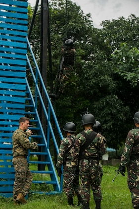 U.S. Marine Corps Sgt. Brent Maholy supervises a group of Philippine airmen as they climb a 40-foot tower to begin fast roping during Air Assault Support Exercise 2015-2 on Basa Air Base in Pampanga, Philippines, July 15, 2015. The exercise is a bilateral training event focused on strengthening the alliance between the Philippines and the U.S. Maholy is a squad leader with 2nd Platoon, Fox Company, 2nd Battalion, 3rd Marines and is attached through the Unit Deployment Program to III Marine Expeditionary Force. The Philippine airmen are with Ground Special Operations Unit, 710th Special Operations Wing, Philippine Air Force. 
