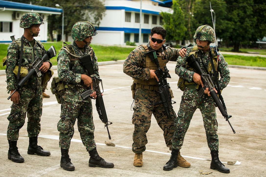 Philippine Marines receive their final instructions from U.S. Marine Corps Lance Cpl. Adrian Talamante before conducting basic urban operations on a tape house during Air Assault Support Exercise 2015-2 at Basa Air Base in Pampanga, Philippines, July 15, 2015. The Marines went through a number of different scenarios to include fire and maneuver with reloading techniques. AASE is a bilateral training event focused on strengthening the alliance between the Philippines and the U.S. The Philippine Marines are with Marine Battalion Landing Team 1, 1st Battalion, Philippine Marine Corps. Talamante is with 2nd Platoon, Fox Company, 2nd Battalion, 3rd Marine Division and attached through the Unit Deployment Program to III Marine Expeditionary Force. 