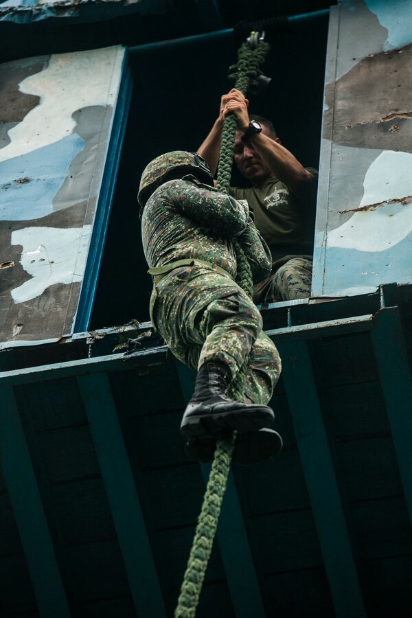 A Philippine Marine learns fast roping under the supervision of U.S. Marines with 2nd Battalion, 3rd Marines during Air Assault Support Exercise 2015-2 at Basa Air Base in Pampanga, Philippines, July 15, 2015. The exercise is a bilateral training event focused on strengthening the alliance between the Philippines and the U.S. The Philippine Marines are with Marine Battalion Landing Team 1, 1st Battalion, Philippine Marine Corps. 