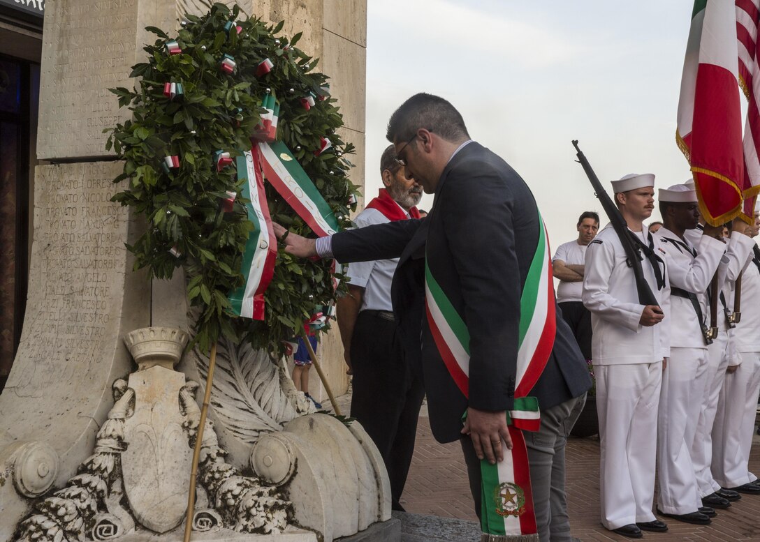 Fabio Venezia, mayor of Troina, Sicily, Italy, pays his respects during a wreath-laying ceremony for the Battle of Troina in World War II in Troina, August 2, 2015. The mayor asked the people of Troina and the American service members to remember the values so many fought and died for: freedom and democracy. (U.S. Marine Corps photo by Cpl. Olivia McDonald/Released)