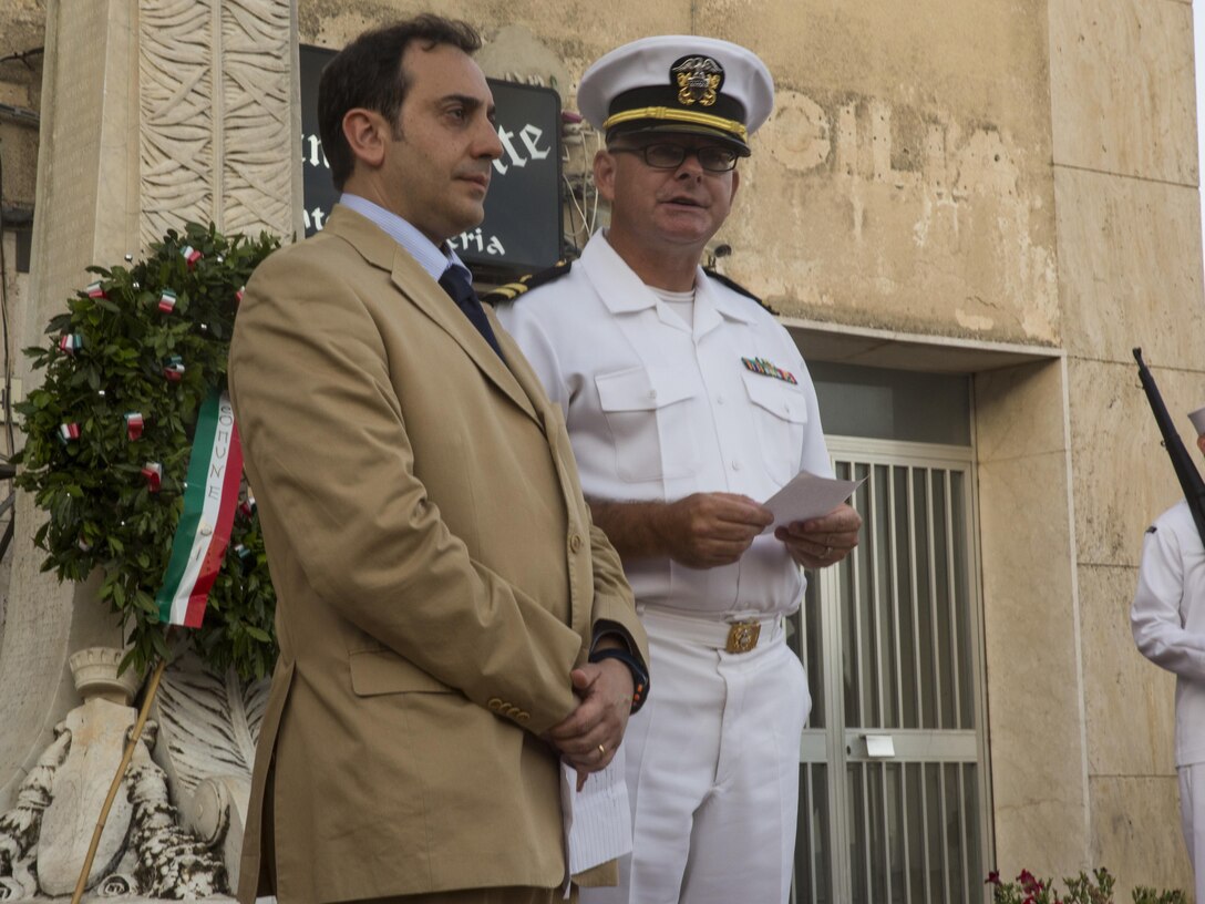 Navy Lt. Derrick Horne, the Special-Purpose Marine Air-Ground Task Force Crisis Response-Africa, Detachment A chaplain, offers a prayer during a wreath-laying ceremony for the World War II Battle of Troina in Troina, Sicily, Italy, August 2, 2015. Horne honored the lives lost in that battle and asked the people of Troina and U.S. military representatives to remember their sacrifices. (U.S. Marine Corps photo by Cpl. Olivia McDonald/Released)