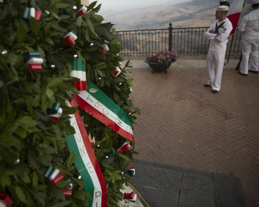 A wreath is laid at the foot of a statue in the center of the town of Troina, Sicily, Italy overlooking the mountains during a World War II remembrance ceremony, August 2, 2015. Every year the town of Troina commemorates and honors the lives lost and remembers the values that won that battle in 1943. (U.S. Marine Corps photo by Cpl. Olivia McDonald/Released)