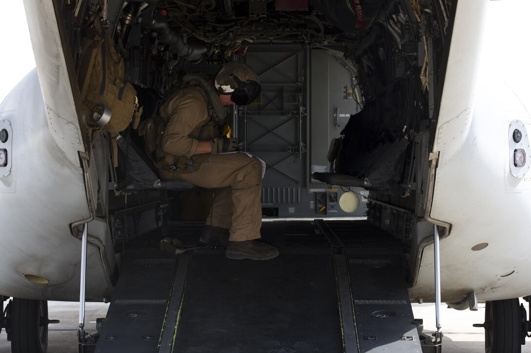 A U.S. Marine with Special-Purpose Marine Air-Ground Task Force-Crisis Response-Africa (SPMAGTF-CR-AF), prepares an MV-22B Osprey for flight during a crisis response drill on Morón Air Base, Spain, Aug. 3, 2015. The crisis response force’s mission requires them to have Marines ready to respond within six hours of an alert in support of U.S. Africa Command. (U.S. Marine Corps photo by Staff Sgt. Keonaona C. Paulo/Released)