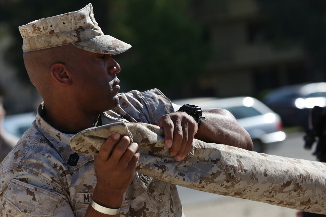 Sergeant Maj. Gregory N. Mitchell and Lt. Col. Alfredo DuBois case the colors of Marine Wing Support Squadron 272 during the Special-Purpose Marine Air-Ground Task Force Crisis Response-Africa Detachment A transfer of authority ceremony, July 30, aboard Naval Air Station Sigonella, Italy. The battalion will be responsible for executing theater security cooperation missions across the African continent. The Marines, sailors and Coast Guardsmen of SPMAGTF-CR-AF will work with partner nations to develop stronger relationships and increase stability across the continent by increasing the capabilities of the host nation militaries. The training will encompass everything from teaching host nation militaries infantry tactics and small-boat operations to convoy operations and vertical engineering.