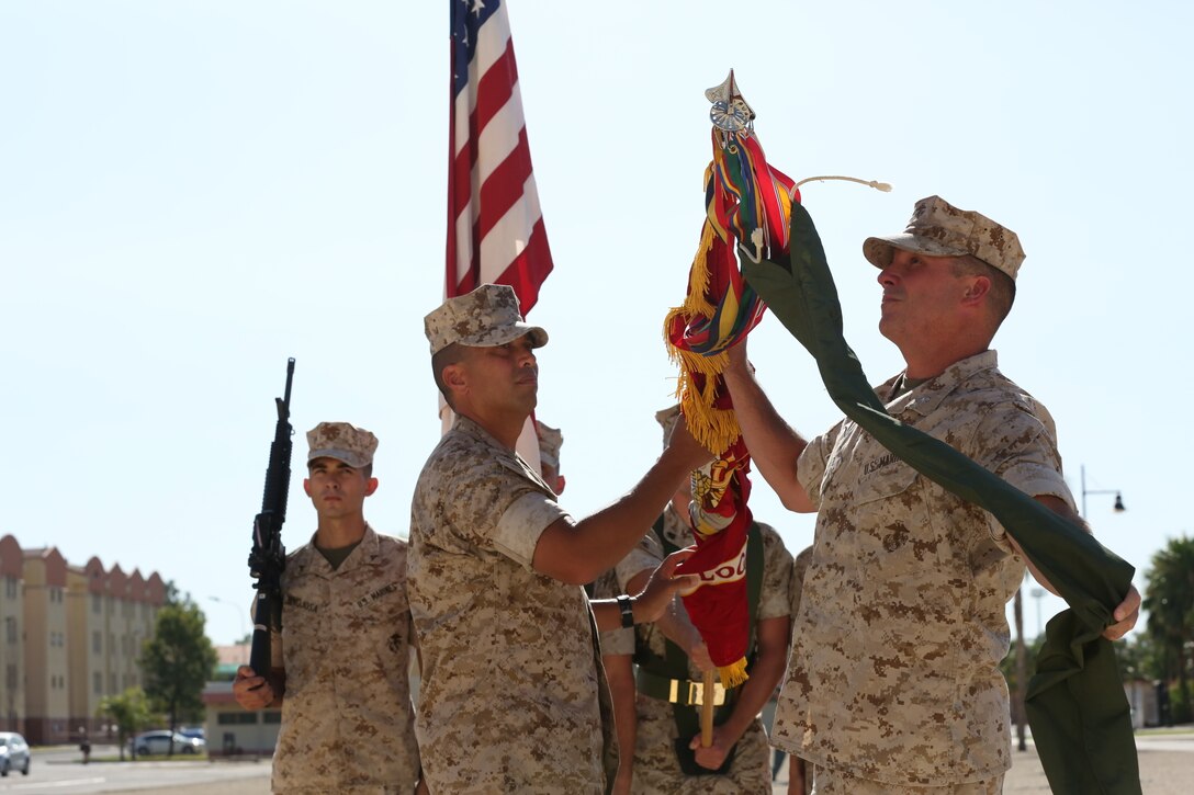Sergeant Maj. Dean S. Orial and Lt. Col. Matthew B. Hakola uncase the Combat Logistics Battalion 6 colors during the Special-Purpose Marine Air-Ground Task Force Crisis Response-Africa Detachment A transfer of authority ceremony, July 30, aboard Naval Air Station Sigonella, Italy. The battalion replaced Marine Wing Support Squadron 272 and will be responsible for executing theater security cooperation missions across the African continent. The Marines, sailors and Coast Guardsmen of SPMAGTF-CR-AF will work with partner nations to develop stronger relationships and increase stability across the continent by increasing the capabilities of the host nation militaries. The training will encompass everything from teaching host nation militaries infantry tactics and small-boat operations to convoy operations and vertical engineering.
