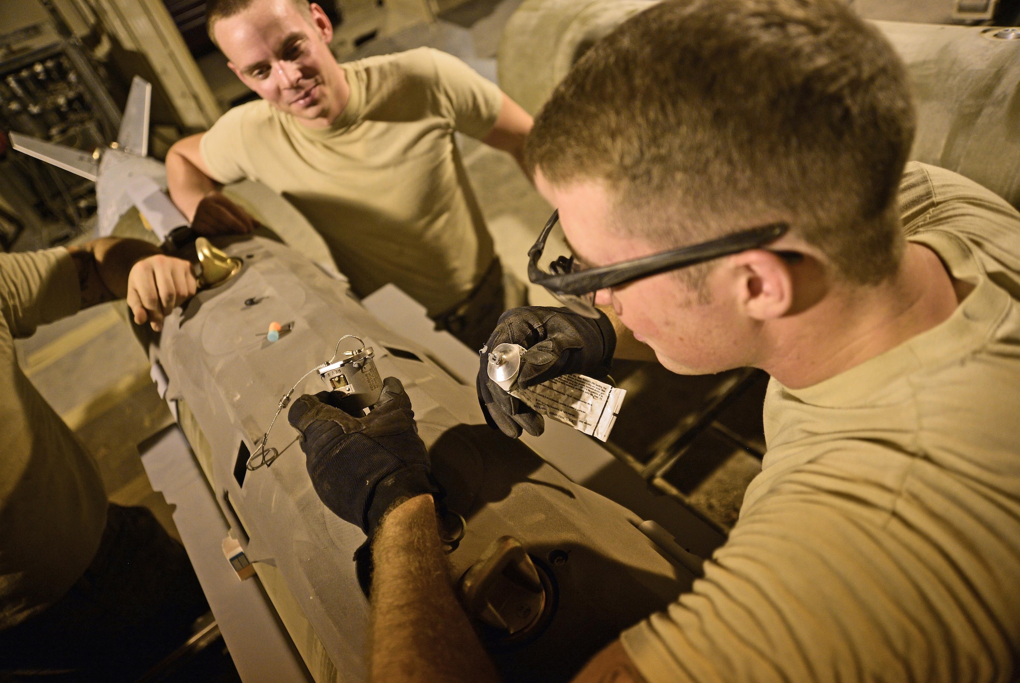 Staff Sgt. Harris, Expeditionary Maintenance Squadron conventional maintenance crew chief, inserts a FZU-55A/B initiator into a Guided Bomb Unit 31 version 3 at an undisclosed location in Southwest Asia July 30, 2015. The FZU-55A/B functions as an electrical power source to the FMU-152 A/B fuse system.  Once the bomb is released from the aircraft, the FZU-55 initiates the explosive train, enabling the munition to detonate on designated targets. (U.S. Air Force photo/Tech. Sgt. Jeff Andrejcik)