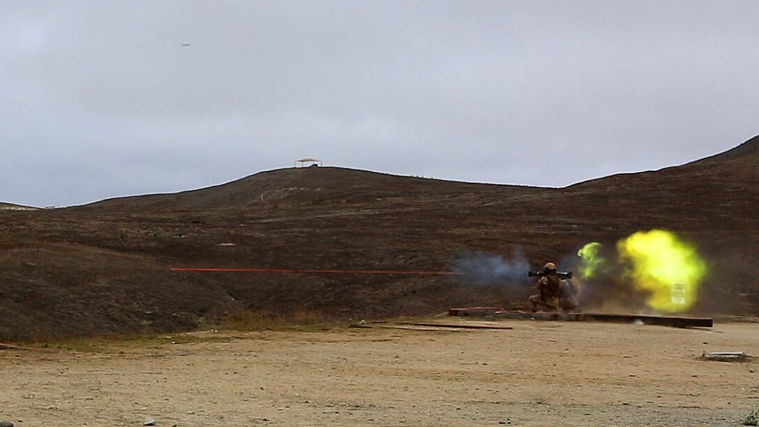 A Marine with Company D, 4th Tank Battalion, 4th Marine Division, fires a tracer round from an AT-4 during a battalion-level Fire Support Coordination Exercise on aboard Marine Corps Base Camp Pendleton, Calif., July 21, 2015. Training included live fire exercises, simulated medical evacuation operations and employing artillery assets to support operations.