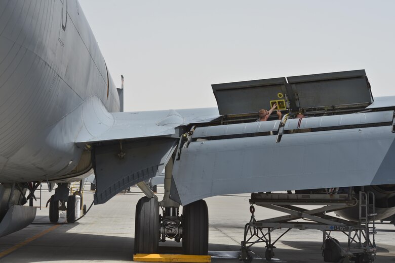 Senior Airman Adam Bentz, 379th Expeditionary Maintenance Squadron's fabrication flight, inserts new rivets to a fabricated KC-135 Stratotanker spoiler access panel August 4, 2015 at Al Udeid Air Base, Qatar. The fabrications flight is partitioned into the aircraft structural maintenance and metal technology sections that make on-site repairs to aircraft deployed to Al Udeid. Most fabrications can be conducted on the flight line. For others, Airmen would bring in the part or create what is needed to keep the aircraft flying within hours. (U.S. Air Force photo/ Staff Sgt. Alexandre Montes)