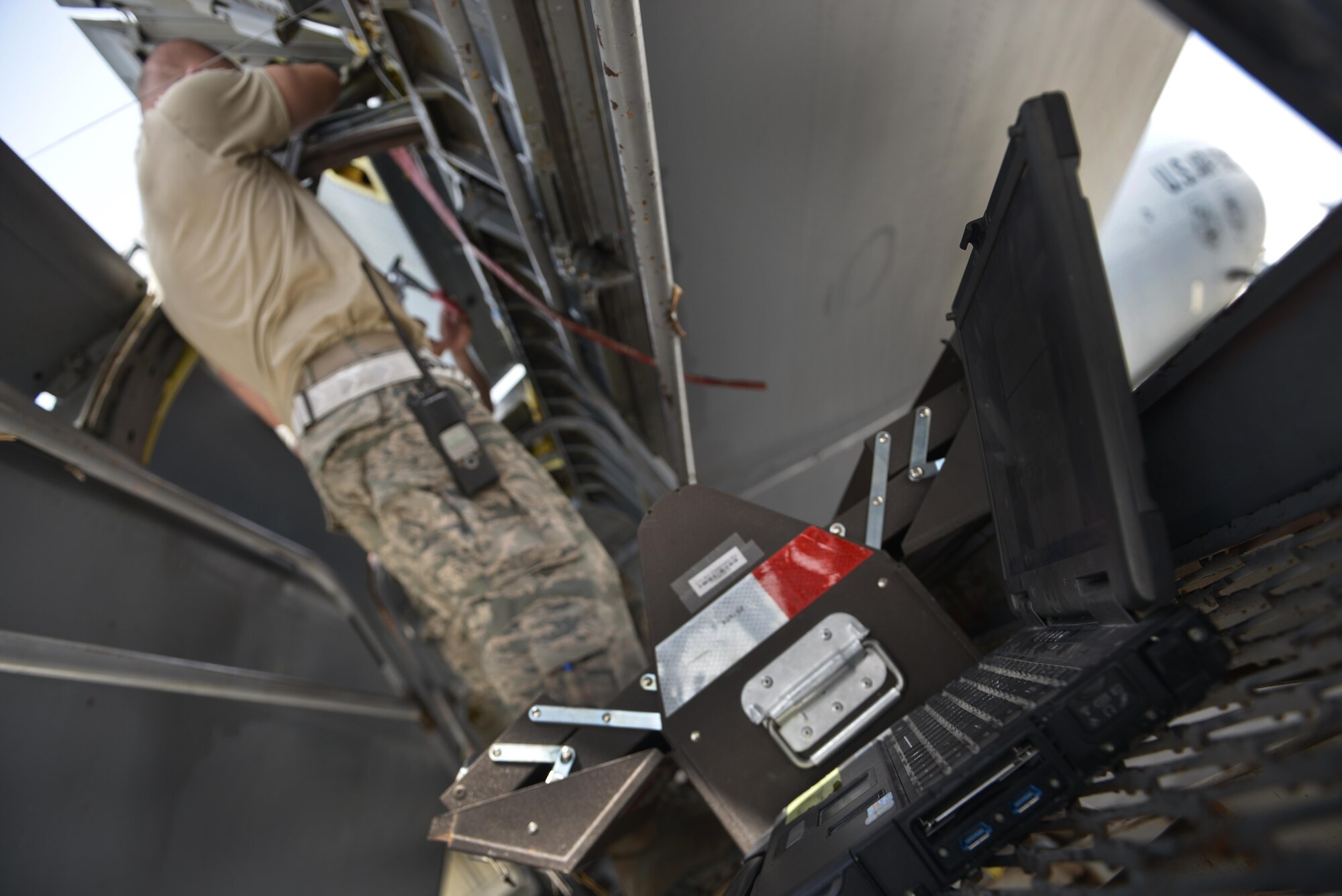 Airmen from the 379th Expeditionary Maintenance Squadron's fabrication flight use several electronic technical orders to ensure they properly adjust, create and repair specific parts of the aircraft deployed to Al Udeid Air Base, Qatar. Some aircraft deployed here include the KC-135 Stratotanker, B-1B Bomber and the C-130J Super Hercules. (U.S. Air Force photo/ Staff Sgt. Alexandre Montes) 