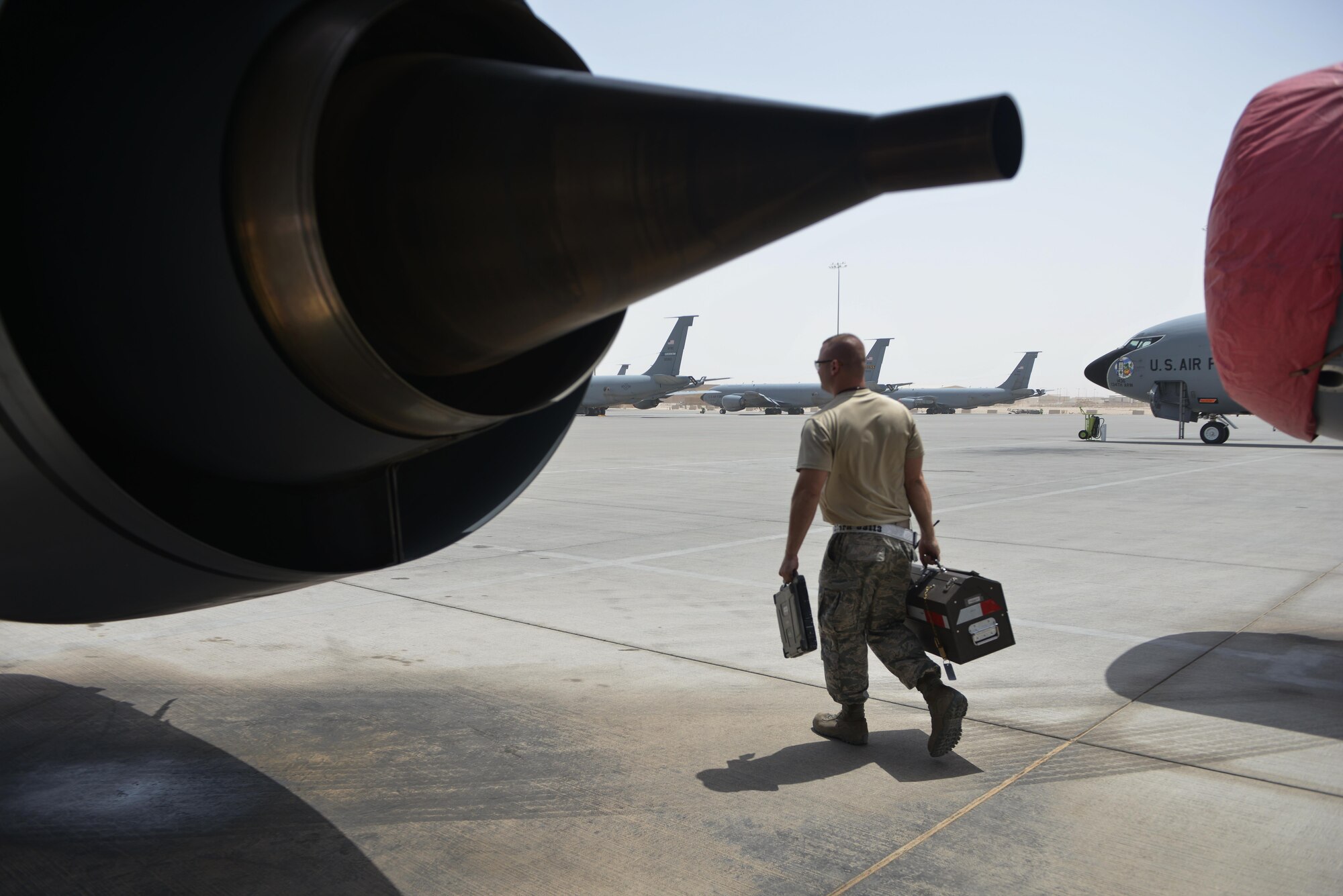 Staff Sgt. David Clark, 379th Expeditionary Maintenance Squadron's fabrication flight, completes his onsite repairs and returns to the maintenance shop for final fabrication of a part August 4, 2015 at Al Udeid Air Base, Qatar. The fabrications flight is partitioned into the aircraft structural maintenance and metal technology sections that make on-site repairs to aircraft deployed to Al Udeid. Most fabrications can be conducted on the flight line. For others, Airmen would bring in the part or create what is needed to keep the aircraft flying within hours. (U.S. Air Force photo/ Staff Sgt. Alexandre Montes)