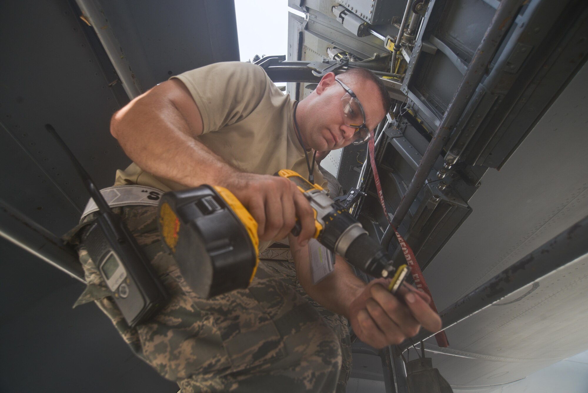 Staff Sgt. David Clark, 379th Expeditionary Maintenance Squadron's fabrication flight, adjusts his drill-bit to match the exact size of rivet needed to repair a KC-135 Stratotanker access panel August 4, 2015 at Al Udeid Air Base, Qatar. The fabrications flight is partitioned into the aircraft structural maintenance and metal technology sections that make on-site repairs to aircraft deployed to Al Udeid. Most fabrications can be conducted on the flight line. For others, Airmen would bring in the part or create what is needed to keep the aircraft flying within hours. (U.S. Air Force photo/ Staff Sgt. Alexandre Montes)
