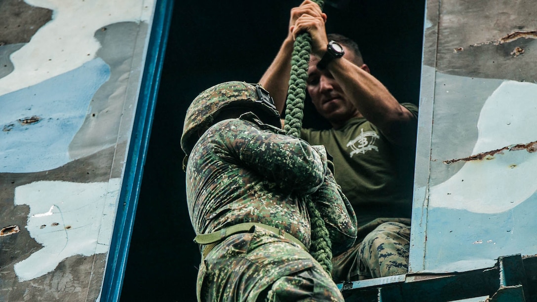 A Philippine Marine learns fast roping under the supervision of U.S. Marines with 2nd Battalion, 3rd Marines during Air Assault Support Exercise 2015-2 at Basa Air Base in Pampanga, Philippines, July 15, 2015. The exercise is a bilateral training event focused on strengthening the alliance between the Philippines and the U.S. The Philippine Marines are with Marine Battalion Landing Team 1, 1st Battalion, Philippine Marine Corps. 