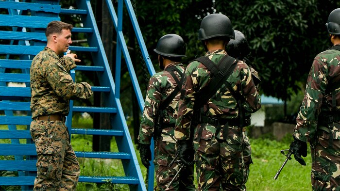 U.S. Marine Corps Sgt. Brent Maholy supervises a group of Philippine airmen as they climb a 40-foot tower to begin fast roping during Air Assault Support Exercise 2015-2 on Basa Air Base in Pampanga, Philippines, July 15, 2015. The exercise is a bilateral training event focused on strengthening the alliance between the Philippines and the U.S. Maholy is a squad leader with 2nd Platoon, Fox Company, 2nd Battalion, 3rd Marines and is attached through the Unit Deployment Program to III Marine Expeditionary Force. The Philippine airmen are with Ground Special Operations Unit, 710th Special Operations Wing, Philippine Air Force. 
