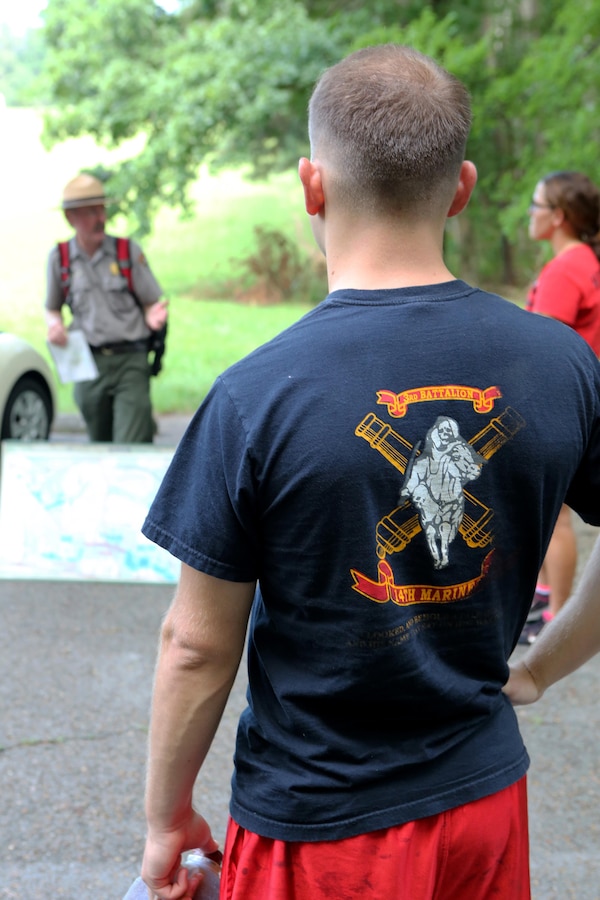 Staff Sgt. Gentry Jones, fire support chief with Battery M, 3rd Battalion, 14th Marine Regiment, Marine Forces Reserve, listens to the history of the Battle of Chickamauga at the Chickamauga and Chattanooga National Military Park in Fort Oglethorpe, Georgia on July 20, 2015. The Marines gathered together at the park to honor their fallen brothers killed by a gunman at the Naval Operational Support Center and Marine Corps Reserve Center in Chattanooga, Tennessee. They also used this opportunity to strengthen their bond as a unit and support each other after the tragedy.