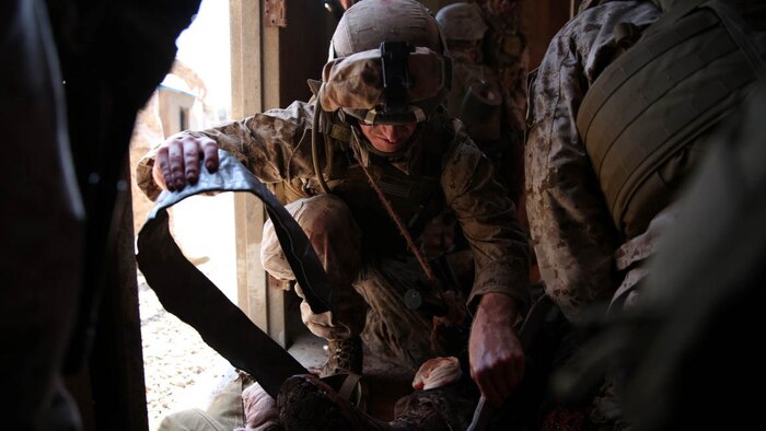 A U.S. Navy corpsman, assigned to the 1st Marine Division, conducts tactical combat casualty care training during the Combat Trauma Management Course, taught by instructors from the 1st Mar. Div. Navy Education and Training Office, at the Strategic Operations facility, San Diego, July 30, 2015. The course, held once a month for 40 students, combines simulated injuries on role players and chaotic battlefield environments to prepare corpsmen and Marine combat life savers for the stress of saving lives in a real world operations.  