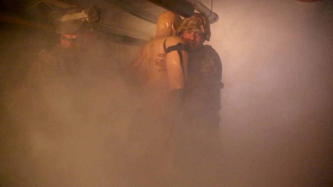 U.S. Navy corpsmen and Marines, assigned to various units in the 1st Marine Division, conduct tactical combat casualty care training during the Combat Trauma Management Course, taught by instructors with the 1st Mar. Div. Navy Education and Training Office, at the Strategic Operations facility, San Diego, July 30, 2015. The course, held once a month for 40 students, combines simulated injuries on role players and chaotic battlefield environments to prepare corpsmen and Marine combat life savers for the stress of saving lives in real world operations. 