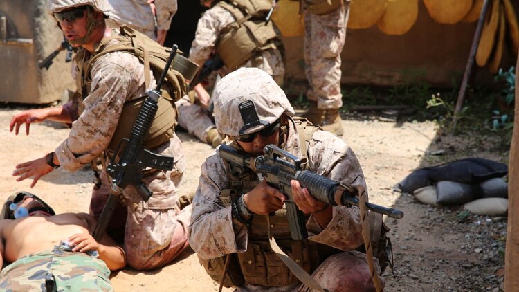 U.S. Navy corpsmen and Marines, assigned to various units in the 1st Marine Division, conduct tactical combat casualty care training during the Combat Trauma Management Course, taught by instructors with the 1st Mar. Div. Navy Education and Training Office, at the Strategic Operations facility, San Diego, July 30, 2015. The course, held once a month for 40 students, combines simulated injuries on role players and chaotic battlefield environments to prepare corpsmen and Marine combat life savers for the stress of saving lives in real world operations.  