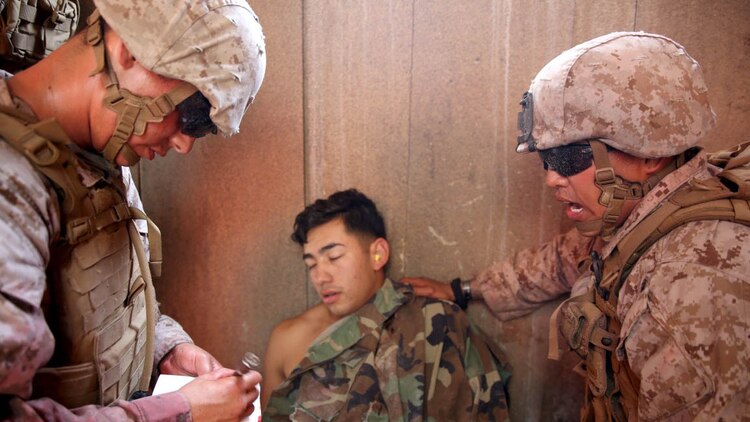 U.S. Navy corpsmen and Marines, assigned to various units in the 1st Marine Division, conduct tactical combat casualty care training during the Combat Trauma Management Course, taught by instructors with the 1st Mar. Div. Navy Education and Training Office, at the Strategic Operations facility, San Diego, July 30, 2015. The course, held once a month for 40 students, combines simulated injuries on role players and chaotic battlefield environments to prepare corpsmen and Marine combat life savers for the stress of saving lives in real world operations. 