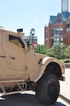 A MATV (Mine Resistant Ambush Protected All Terrain Vehicle) seemingly stands
watch over the Frontier Airlines Center in downtown Milwaukee, site of the
133rd National Guard Association of the United States General Conference and
Exhibition. Military vehicles were part of a static display alongside the Frontier Airlines Center. 