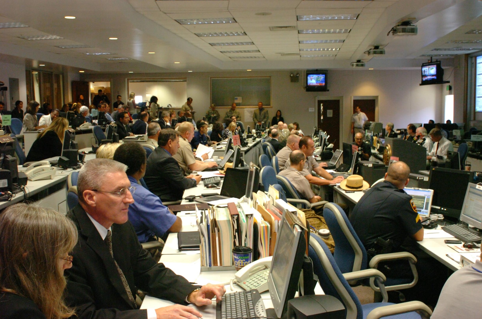Up to 101,000 National Guard troops are available to help East Coast
residents facing Hurricane Irene. Here, agencies from across Maryland gather
together in the Emergency Operations Center to coordinate efforts in preparing for adverse weather conditions expected due to the storm. (Maryland National Guard photo) (Released)