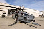 Alaska Air National Guardsmen from the 176th Aircraft Maintenance Squadron
and the 176th Maintenance Squadron fold the rotor blades of an HH-60 Pave
Hawk helicopter Aug. 26, 2011, before they load the helicopter on to a U.S.
Air Force C-17 Globemaster III. The Guard members are preparing to deploy
search-and-rescue assets to the east coast for support operations following
landfall of Hurricane Irene.