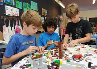 Davis Chancey, Miguel Heredia and Mason Chancey create a stop motion animation movie July 28 during Geekbus at the Joint Base San Antonio-Randolph Youth Center.