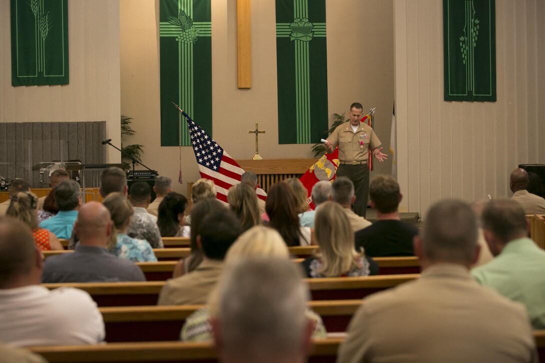 Col. John E. Kasperski, assistant chief of staff G-4, thanks the officers and enlisted Marines he worked alongside throughout his 29 years of service during his retirement ceremony at the Protestant Chapel, July 31, 2015. During the ceremony, Kasperski was awarded the Legion of Merit along with an American flag that was flown over the Combat Center, in recognition of his service, July 11.