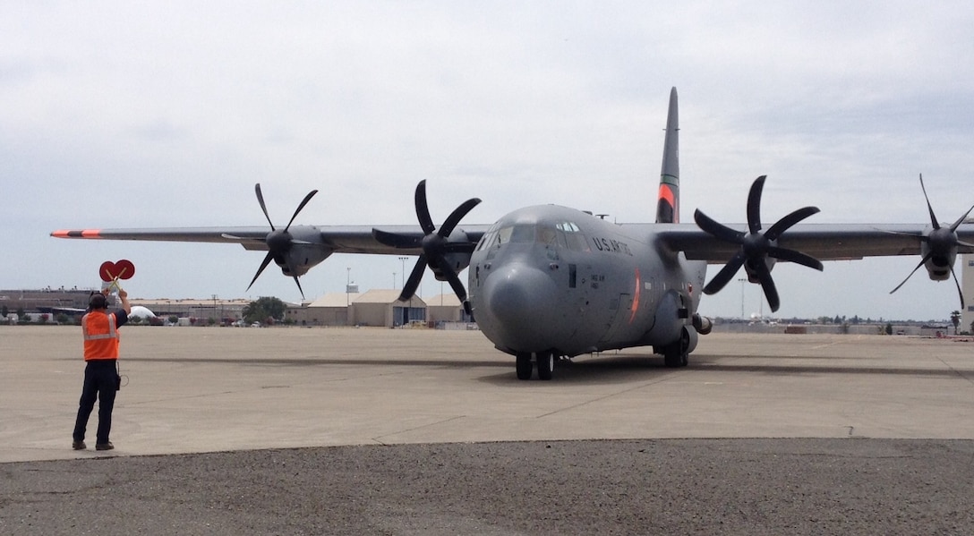 A C-130J Super Hercules, assigned to the California Air National Guard's 146th Airlift Wing, taxis to a reload "pit" to take on nearly 3,000 gallons of fire retardant at McClellan Air Tanker Base in Sacramento, California, Aug. 4, 2015. The aircrew received a tasking to provide support to the growing Rocky Fire north of San Francisco, which had consumed approximately 65,000 acres as of Aug. 4. The crew was joined three other C-130s from the 146th AW and the Air Force Reserve's 302nd Airlift Wing to combat the Rocky Fire. The aircraft contain the Modular Airborne Fire Fighting System which allows them to support wildfire containment in conjunction with fire crews on the ground. The 146th AW is based in Channel Islands, while the 302nd AW is stationed at Peterson Air Force Base, Colorado. (U.S. Air Force photo/2nd Lt. Stephen J. Collier)
