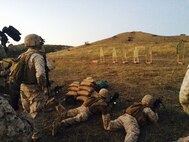Marines from Bravo Company prepare for a night live fire exercise.