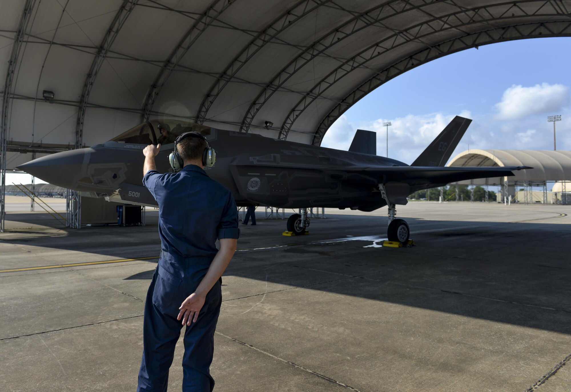 Airman 1st Class Zachary Weeks, 33rd Aircraft Maintenance Squadron crew chief, launches an F-35A Lighting II at Eglin Air Force Base, Fla., August 4, 2015. Week’s responsibility on the flight line is to safely inspect and launch the F-35A Lighting II. (U.S. Air Force Photo/Senior Airman Andrea Posey)