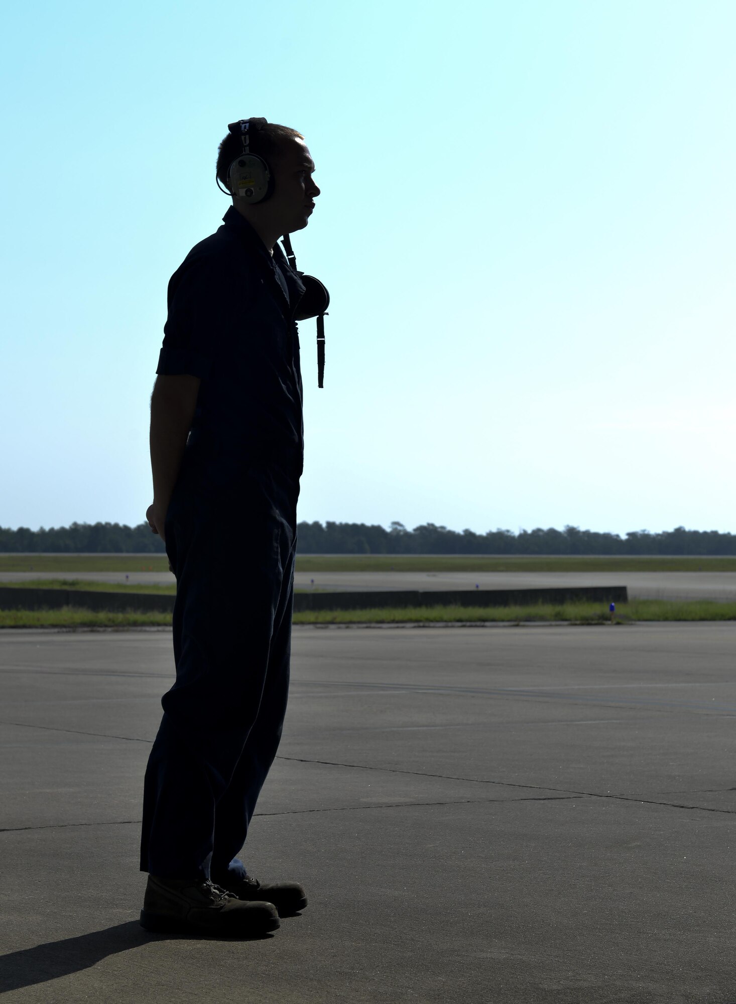 Airman 1st Class Zachary Weeks, 33rd Aircraft Maintenance Squadron crew chief, awaits the launch of an F-35A Lighting II at Eglin Air Force Base, Fla., August 4, 2015. Week’s responsibility on the flight line is to safely inspect and launch the F-35A Lighting II. (U.S. Air Force Photo/Senior Airman Andrea Posey)