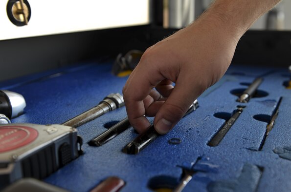 Airman 1st Class Zachary Weeks33rd Aircraft Maintenance Squadron crew chief, puts his tools away in an Aerospace propulsion general maxi at Eglin Air Force Base, Fla., August 4, 2015. Week’s responsibility on the flight line is to safely inspect and launch the F-35A Lighting II. (U.S. Air Force Photo/Senior Airman Andrea Posey)