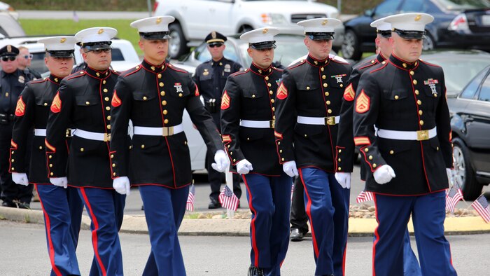 Marines of Battery M, 3rd Battalion 14th Marine Regiment, Marine Forces Reserve, march together at the Methodist Church in Hixson, Tennessee, July 24, 2015. The Marines attended the funeral of their fallen brother, Staff Sgt. David A. Wyatt, one of five service members killed by a gunman at the Naval Operational Support Center and Marine Corps Reserve Center on July 16, 2015. Wyatt was taken to the Chattanooga National Cemetery after the church service to be laid to rest with full military honors.