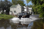 Maryland National Guard Soldiers from units across the state, seen here Aug.
28, 2011, worked around the clock to provide critical support to civilian law
enforcement and firefighting agencies in Salisbury, Md., during Hurricane Irene.