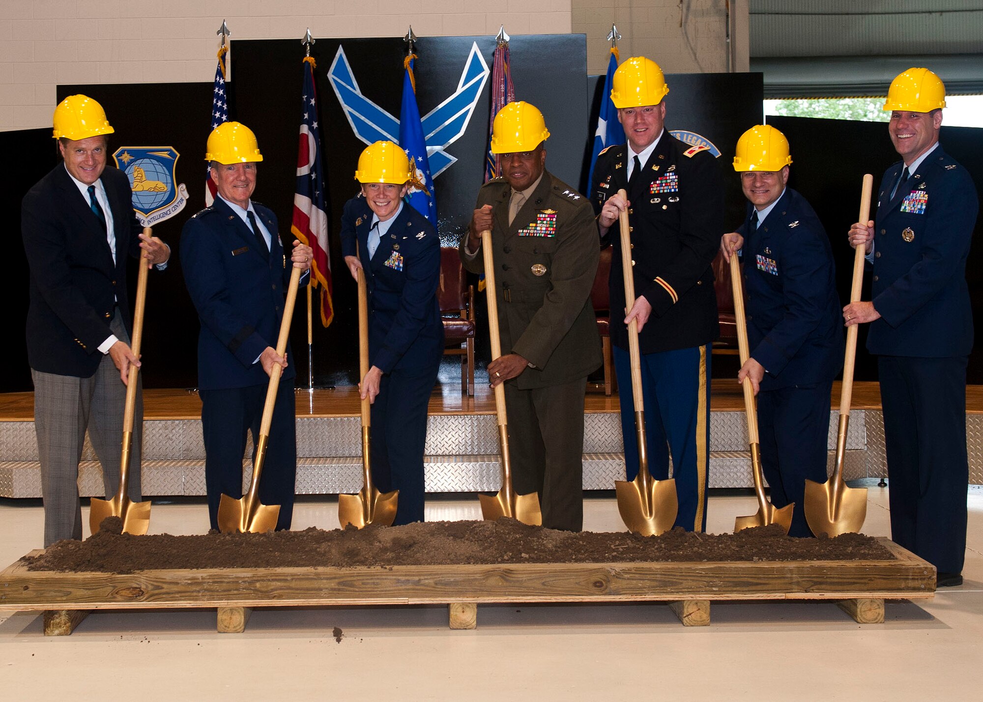 From left to right, Michael Turner, congressman, Gen. Herbert “Hawk” Carlisle, Air Combat Command commander, Col. Leah Lauderback, National Space Intelligence Center commander, Lt. Gen. Victor Stewart, Defense Intelligence Agency, Col. Christopher Beck, U.S. Army Corps of Engineers Louisville District commander, Col. Brian May, Air Force Civil Engineer Center director , Col. John Devillier, 88th Air Base Wing commander, break ground at the foreign material exploitation facility’s groundbreaking ceremony Friday June 19, 2015. The $30 million, 58,000 square-foot addition will nearly triple the size of the existing facility, and doubles the lab space, enabling NASIC to execute the ever-increasing number of projects protected at higher classification levels. (U.S. Air Force photo by Airman 1st Class Samuel Earick)