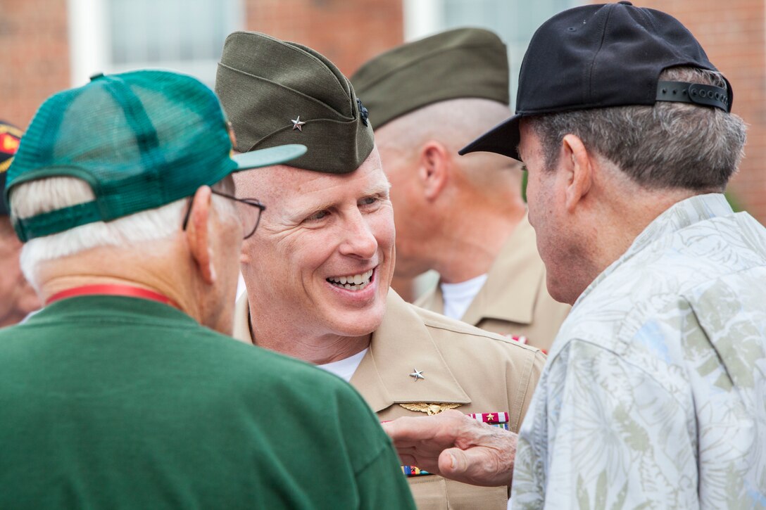 U.S. Marine Corps Brig. Gen. Thomas D. Weidley, commanding general of Marine Corps Installations East-Marine Corps Base Camp Lejeune speaks to veterans of 4th Marine Division after a morning colors ceremony on Camp Lejeune, N.C., Aug. 4, 2015. 