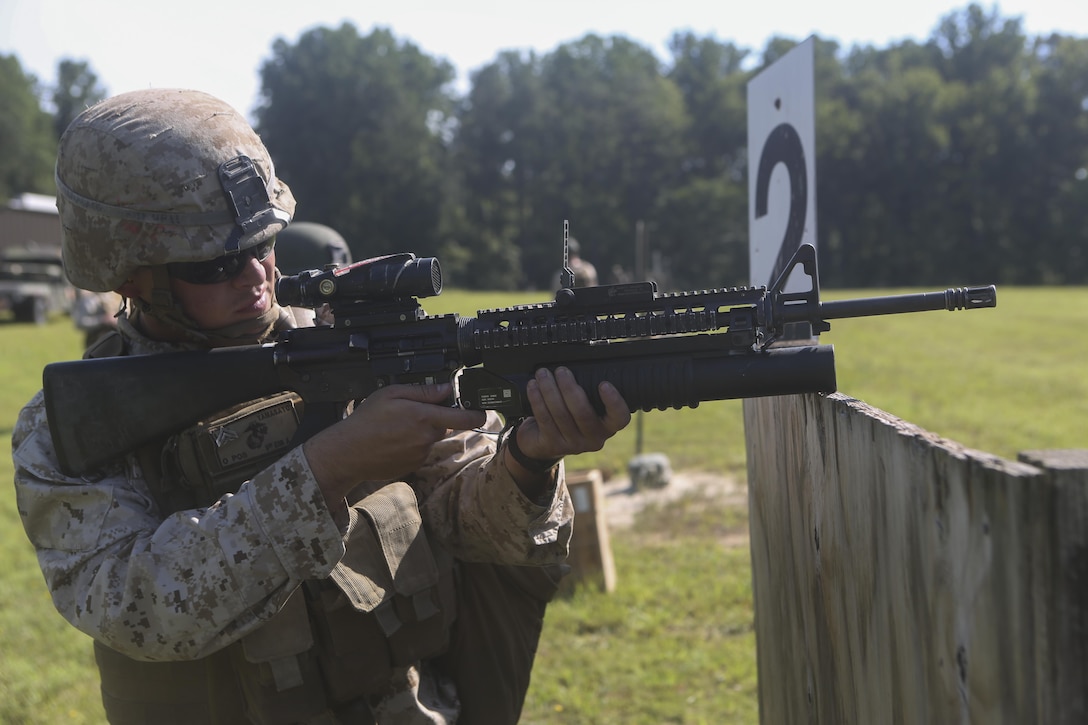 A Marine with 2nd Combat Engineer Battalion shoots a training round from his M203 grenade launcher from the standing position during a battle sight zero range at Fort A.P. Hill, Va., Aug. 1, 2015. The range prepared the Marines’ weapons for firing and marked the beginning of a three-week-long deployment for training where the battalion will enhance the Marines’ knowledge of their combat engineer skills in a unique training environment to prepare them for upcoming deployments. (U.S. Marine Corps photo by Cpl. Michelle Reif/Released)