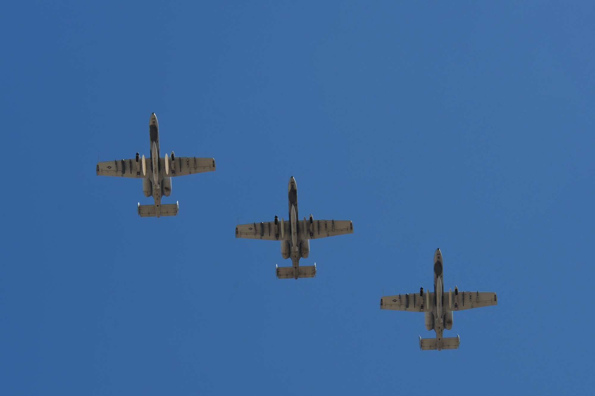 Three U.S. Air Force A-10C Thunderbolt IIs from the 354th Fighter Squadron fly in formation over Davis-Monthan Air Force Base, Ariz., Aug. 4, 2015. Twelve A-10s and their pilots from the 354th FS returned after a 6-month-long deployment to Europe where they flew over 1,500 missions throughout 21 countries as part of the Theater Security Package to Europe in support of Operation Atlantic Resolve. (U.S. Air Force photo by Senior Airman Chris Massey/Released)