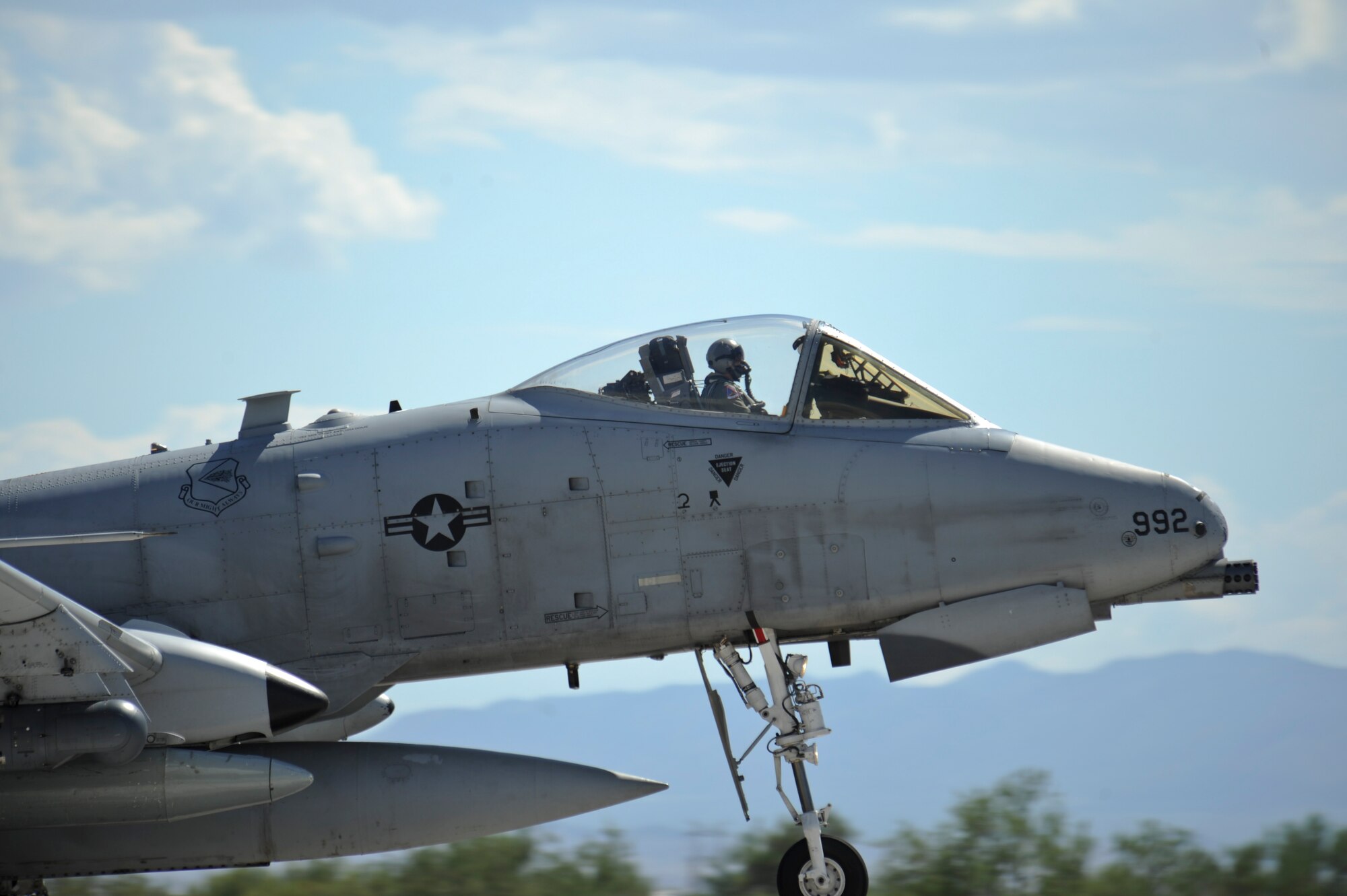 A U.S. Air Force A-10C Thunderbolt II from the 354th Fighter Squadron touches down on the runway at Davis-Monthan Air Force Base, Ariz., after returning from a 6-month deployment, Aug. 4, 2015. While deployed, the 354th Fighter Squadron participated in 21 exercises, compiling more than 1,500 flying missions and nearly 2,700 flight hours while engaging with 22 countries. (U.S. Air Force photo by Senior Airman Chris Massey/Released)