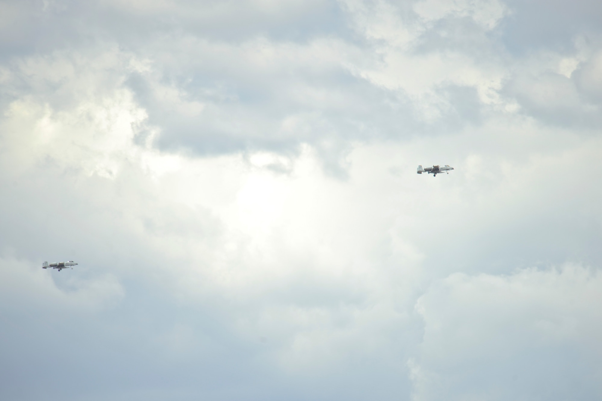 Two U.S. Air Force A-10C Thunderbolt IIs from the 354th Fighter Squadron circle in preparation for landing at Davis-Monthan Air Force Base, Ariz., Aug. 4, 2015. Twelve A-10s and their pilots from the 354th FS returned after a 6-month-long deployment to Europe where they flew over 1,500 missions throughout 21 countries as part of the Theater Security Package to Europe in support of Operation Atlantic Resolve. (U.S. Air Force photo by Senior Airman Chris Massey/Released)