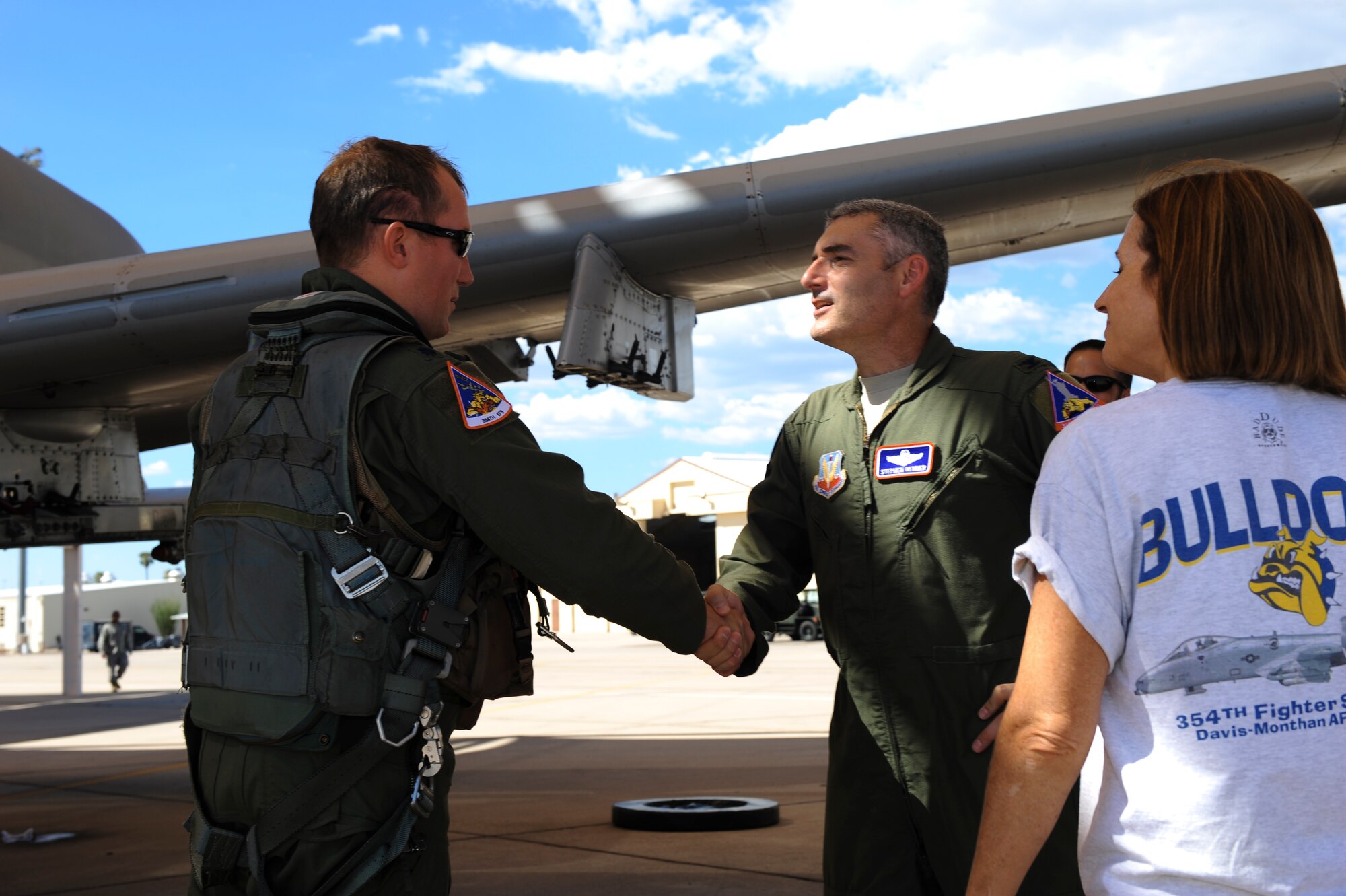 U.S. Air Force Col. Stephen Renner, 355th Fighter Wing vice commander, greets Lt. Col. Ryan Hayde, 354th Fighter Squadron commander,on the flightline at Davis-Monthan Air Force Base, Ariz., after Hayde returned from a deployment August 4, 2015.Twelve A-10s and their pilots from the 354th FS returned after a 6-month-long deployment to Europe where they flew over 1,500 missions throughout 21 countries as part of the Theater Security Package to Europe in support of Operation Atlantic Resolve. (U.S. Air Force photo by Airman 1st Class Chris Drzazgowski/Released) 