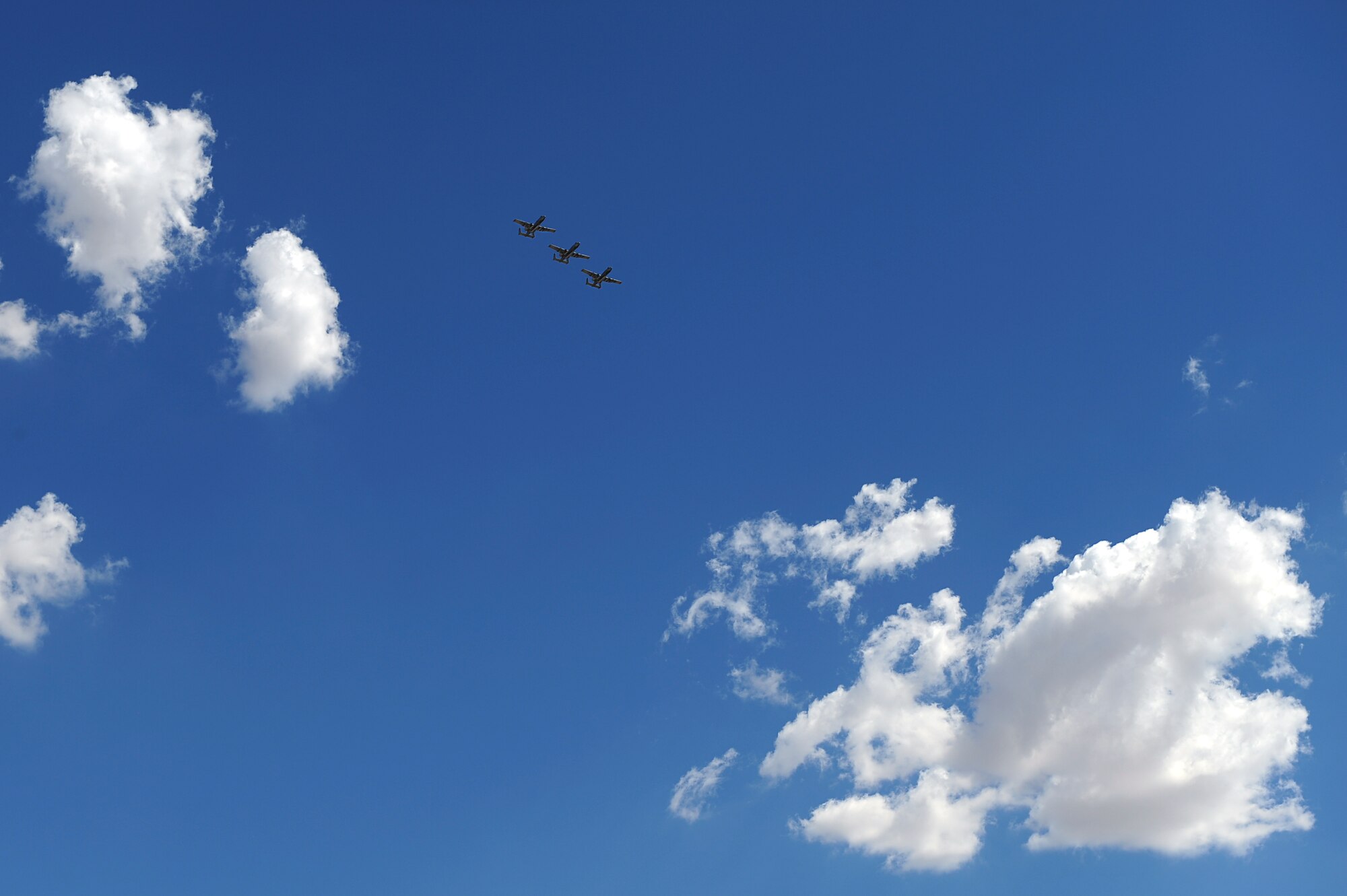 Three U.S. Air Force A-10C Thunderbolt IIs fly in formation over Davis-Monthan Air Force Base, Ariz., August 4, 2015. Twelve A-10s and their pilots from the 354th Fighter Squadron returned after a 6-month-long deployment to Europe where they flew over 1,500 missions throughout 21 countries as part of the Theater Security Package to Europe in support of Operation Atlantic Resolve. (U.S. Air Force photo by Airman 1st Class Chris Drzazgowski/Released) 