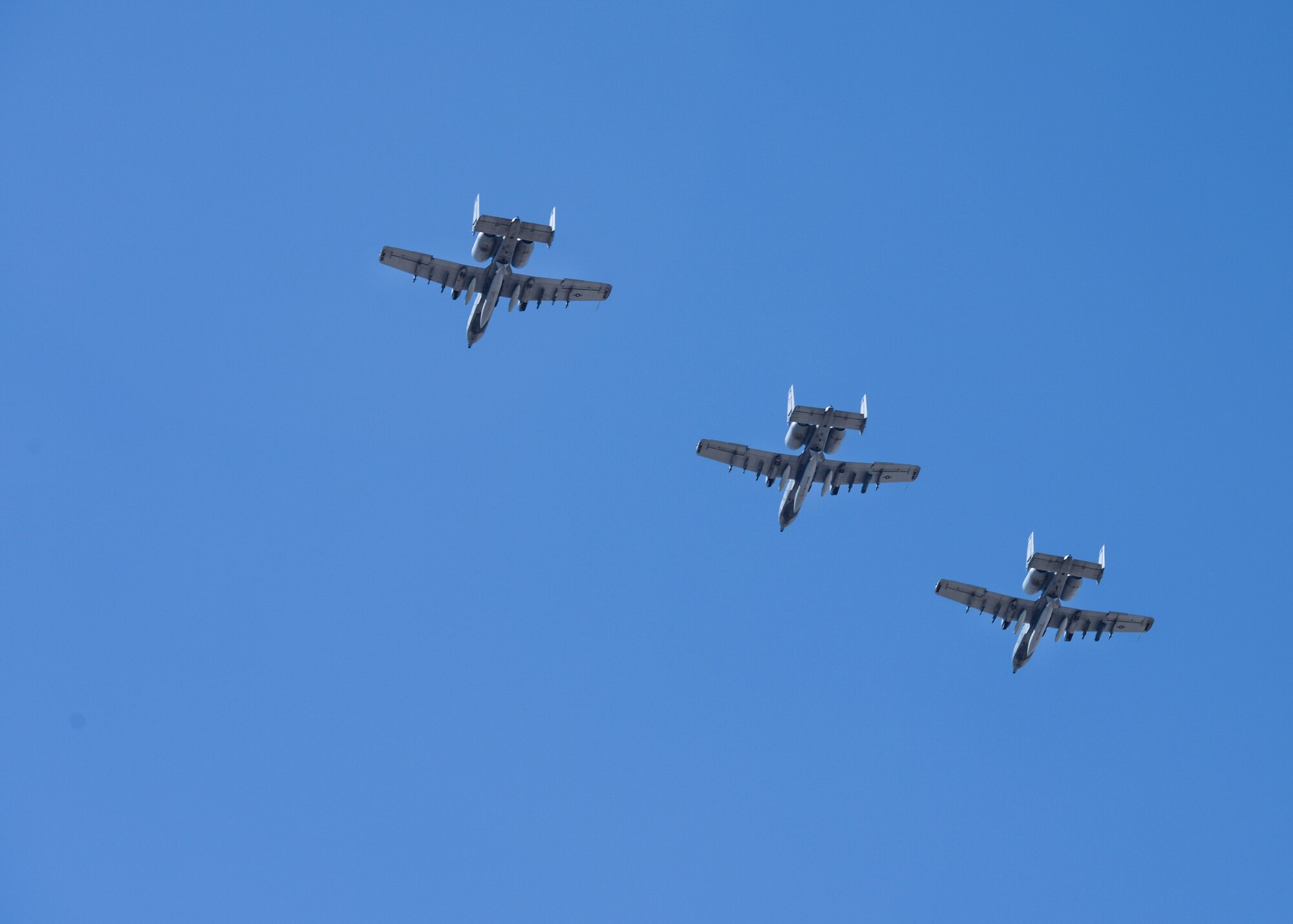 Three A-10C Thunderbolt II aircraft prepare to land at Davis-Monthan Air Force Base Ariz., Aug. 4, 2015, after a 6-month long deployment. A-10s possess a wide combat radius and allow for a short takeoff and landing capabilities aiding in missions in and out of locations near front lines. (U.S. Air Force photo by Airman 1st Class Ashley N. Steffen/ Released)