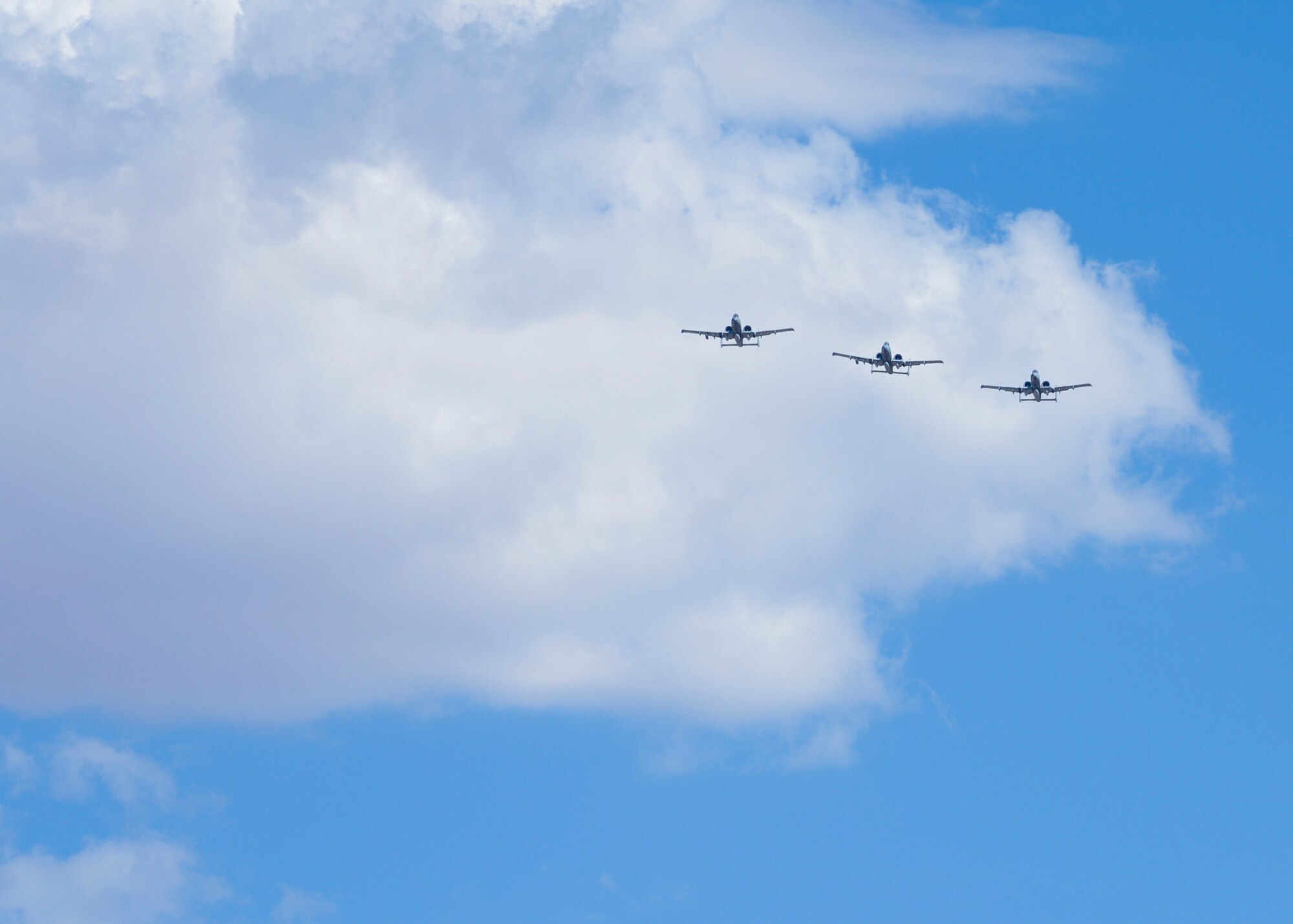 Three A-10C Thunderbolt IIs from the 354th Fighter Squadron fly over Davis-Monthan Air Force Base Ariz., on their return home from a six month deployment, Aug. 4, 2015. The 354th FS was deployed to the first European Theater Security Package in support of Operation Atlantic Resolve. (U.S. Air Force photo by Airman 1st Class Ashley N. Steffen/ Released)