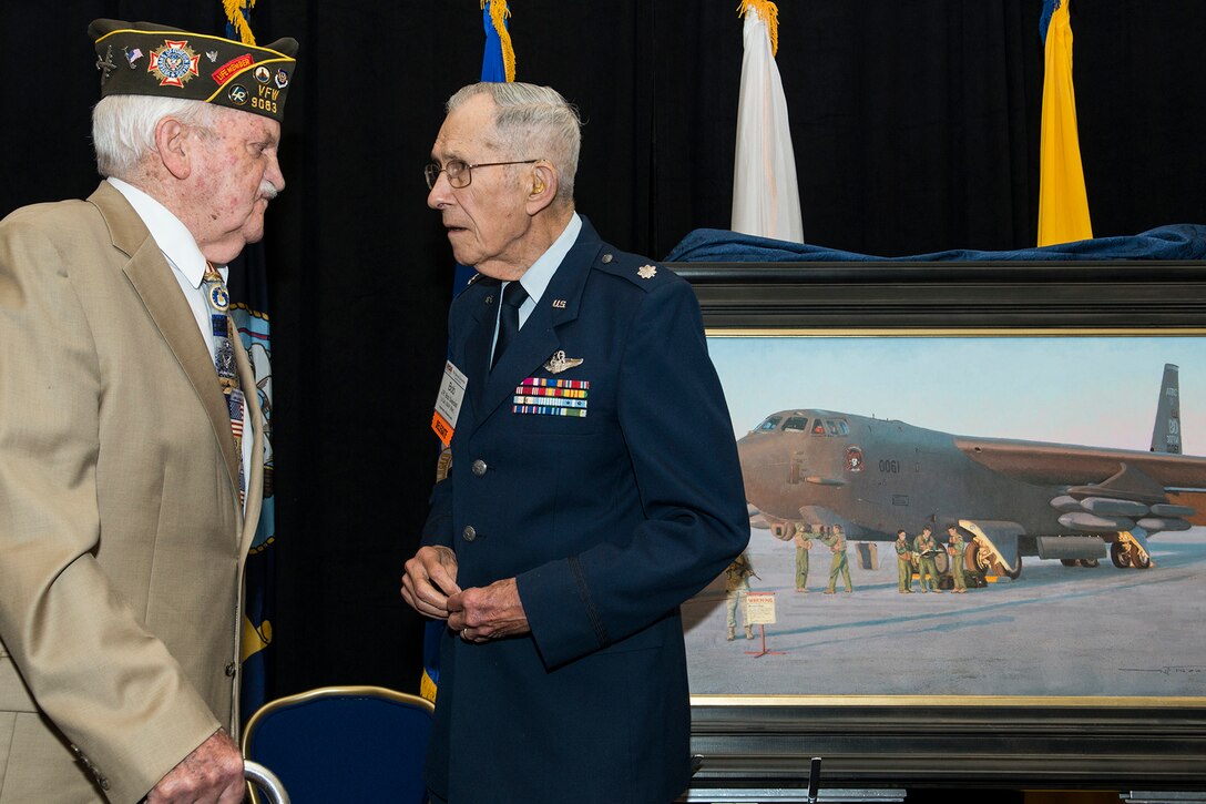 Retired Tech. Sgt. John Wright and retired Brig. Gen. James Swindell talk following the unveiling ceremony for the painting “Deterrence on Demand”, Washington D.C., July 27, 2015. Wright is a former World War II B-24 Liberator radar operator assigned to the 307th Bombardment Group, and Swindell was assigned to the 307th Bomb Wing during the Korean War and was a B-29 Superfortress navigator. (U.S. Air Force photo by Master Sgt. Greg Steele/Released)